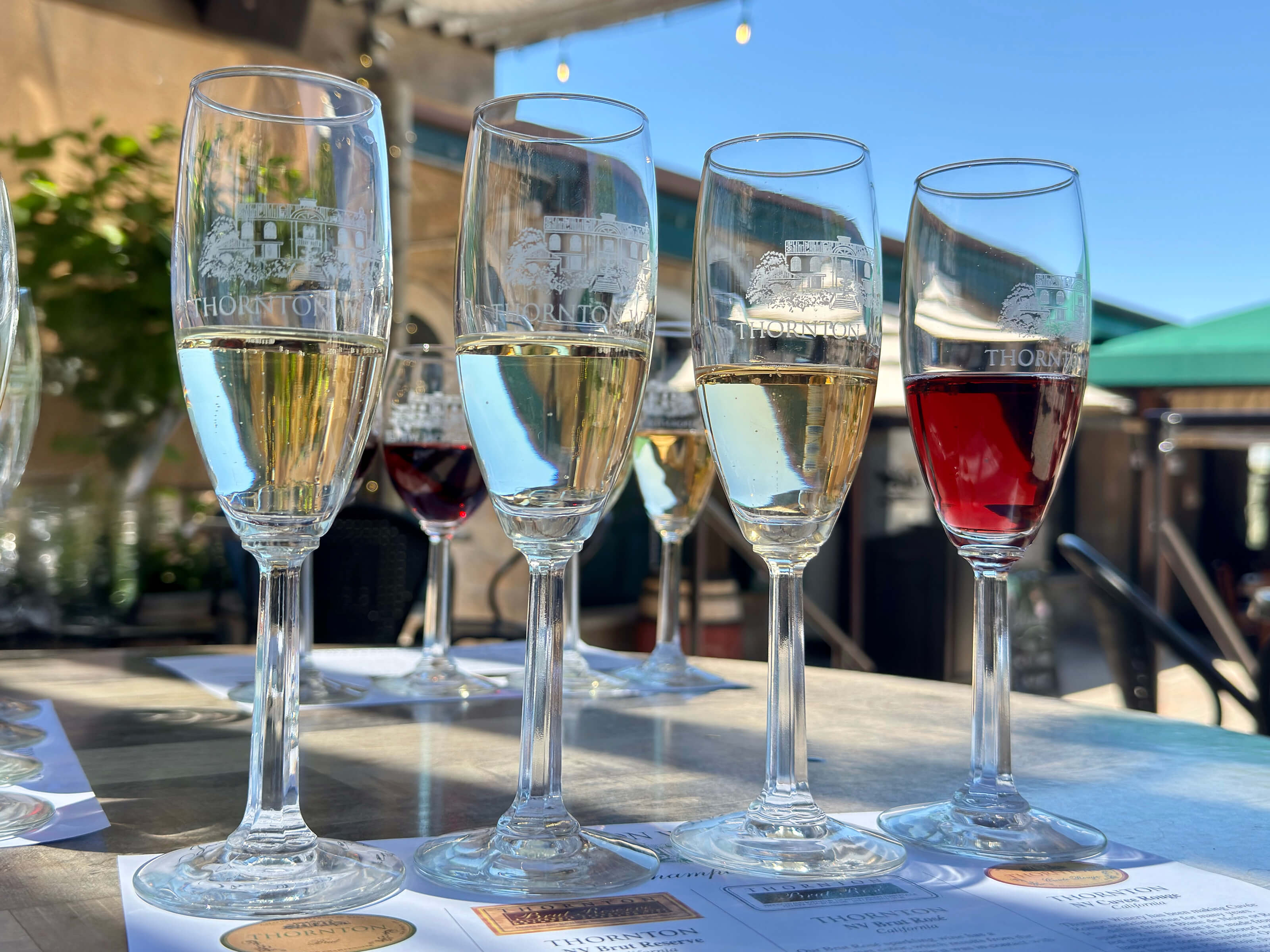 A flight of 4 sparkling wines.